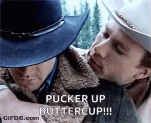 A Man In A Cowboy Hat Is Hugging Another Man In A Cowboy Hat . GIF