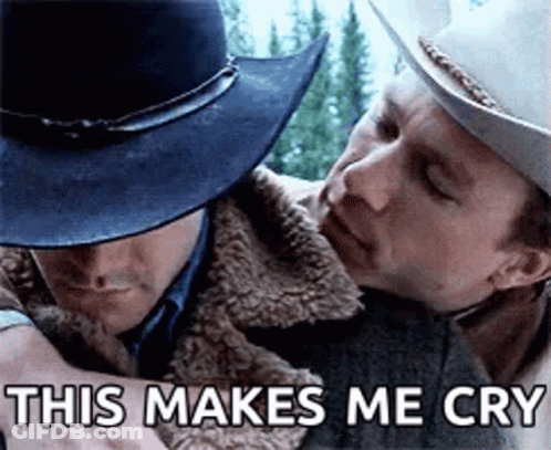 A Man In A Cowboy Hat Is Hugging Another Man In A Jacket . GIF