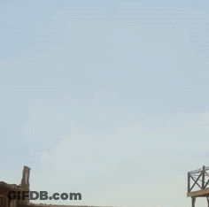 A Man In A Cowboy Hat Is Raising His Fist GIF