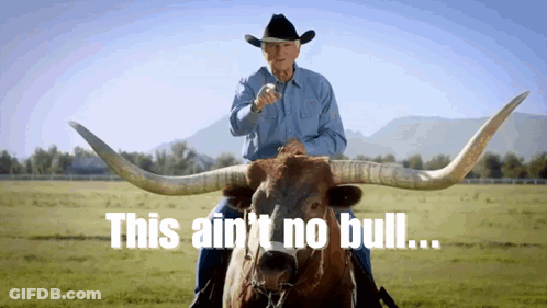 A Man In A Cowboy Hat Is Riding A Bull With The Words This Ain T No Bull GIF