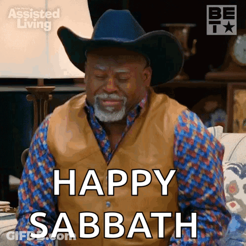 A Man In A Cowboy Hat Is Saying Happy Sabbath . GIF