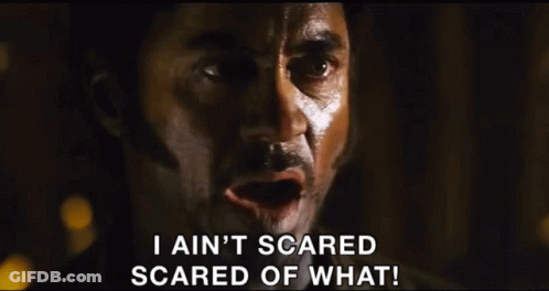 A Man In A Cowboy Hat Is Saying I Ain 'T Scared Scared Of What GIF