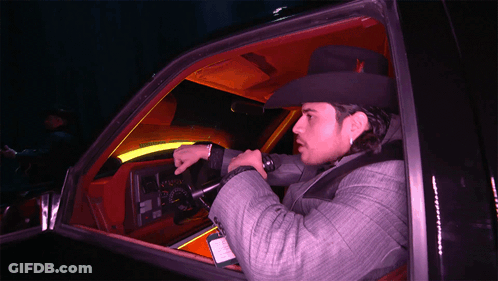 A Man In A Cowboy Hat Is Sitting In A Car GIF