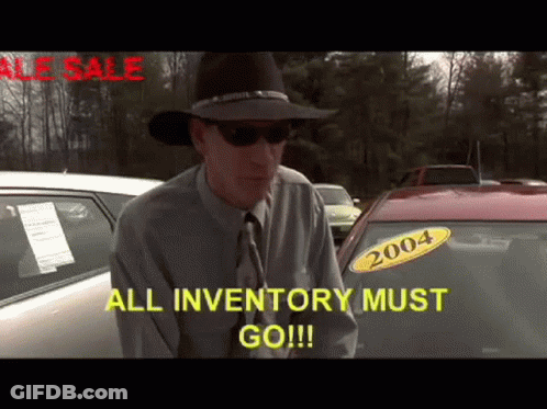 A Man In A Cowboy Hat Is Standing In Front Of A Car With A 2004 Sticker On It GIF