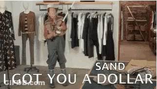 A Man In A Cowboy Hat Is Standing In Front Of A Clothes Rack Holding A Dog . GIF