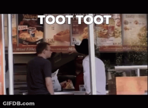 A Man In A Cowboy Hat Is Standing In Front Of A Fast Food Restaurant And Says Toot Toot GIF