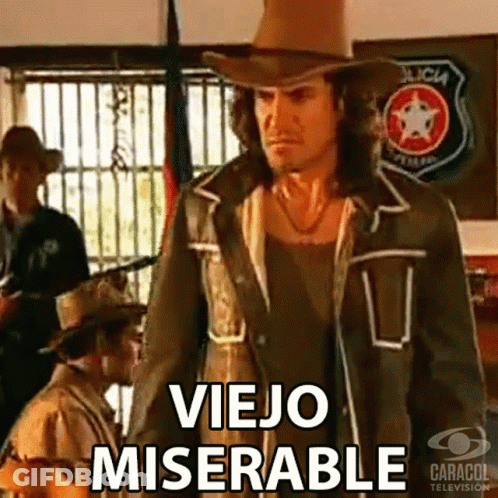 A Man In A Cowboy Hat Is Standing In Front Of A Sign That Says Policia GIF