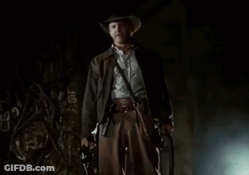 A Man In A Cowboy Hat Is Standing In Front Of The Word Part GIF