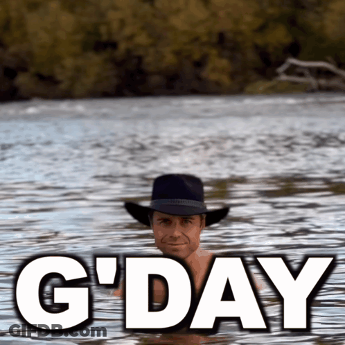 A Man In A Cowboy Hat Is Swimming In A Body Of Water With The Words G'day Written Above Him GIF