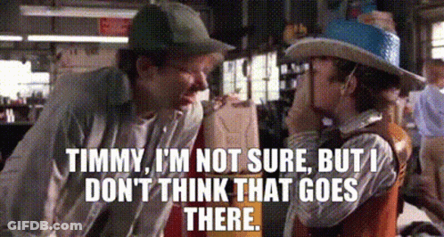 A Man In A Cowboy Hat Is Talking To A Little Boy In A Cowboy Outfit . GIF