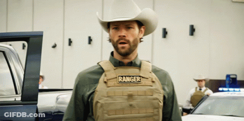 A Man In A Cowboy Hat Is Wearing A Vest That Says Ranger GIF
