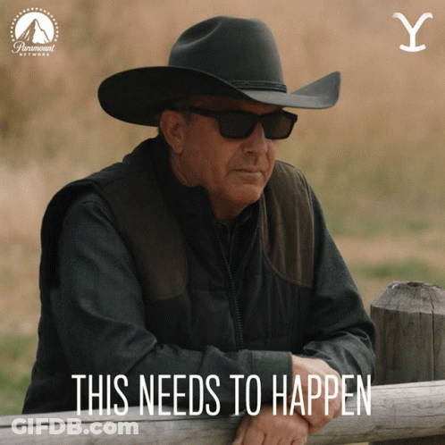 A Man In A Cowboy Hat Leans On A Wooden Fence With The Words This Needs To Happen GIF