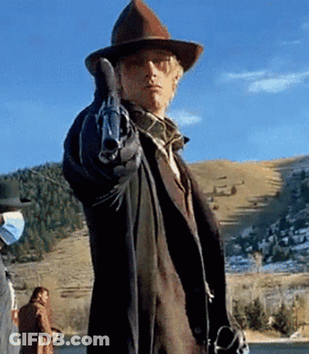 A Man In A Cowboy Hat Pointing A Gun GIF