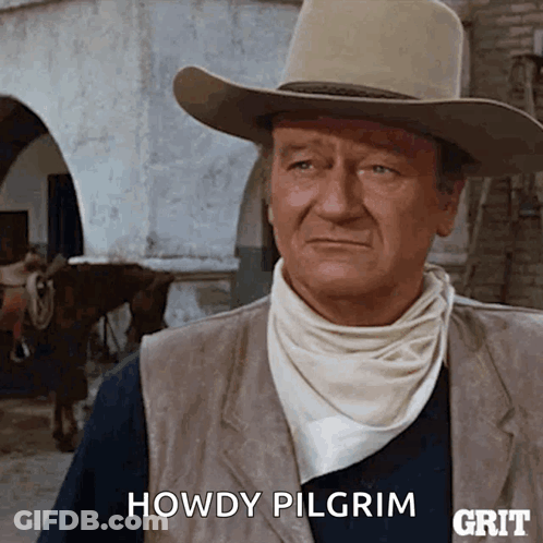 A Man In A Cowboy Hat Says Howdy Pilgrim In Front Of A Horse GIF