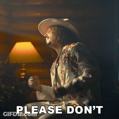 A Man In A Cowboy Hat Says Please Don 'T In Front Of A Lamp GIF
