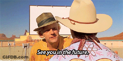 A Man In A Cowboy Hat Says " See You In The Future " While Another Man Looks On GIF