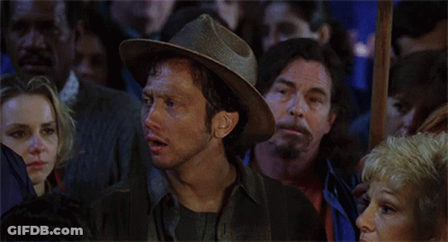 A Man In A Cowboy Hat Says We Suck Again In Front Of A Crowd GIF
