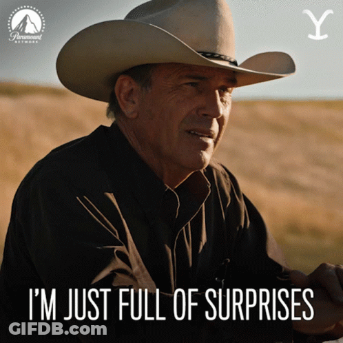 A Man In A Cowboy Hat With The Words I 'M Just Full Of Surprises Below Him GIF