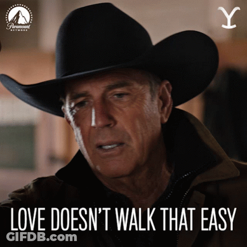 A Man In A Cowboy Hat With The Words Love Does N't Walk That Easy GIF