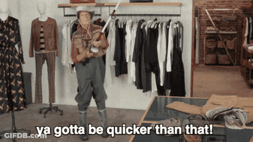A Man In A Cowboy Outfit Is Saying Ya Gotta Be Quicker Than That In A Clothing Store GIF