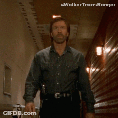 A Man In A Cowboy Shirt Is Walking Down A Hallway With The Hashtag #Walkertexasranger GIF