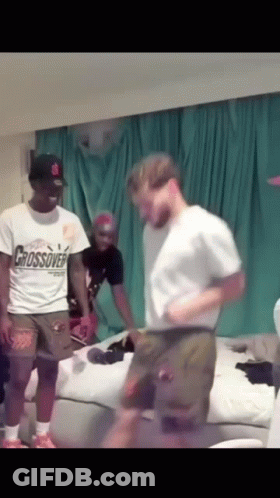 A Man In A Crossover Shirt Is Dancing GIF