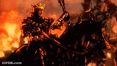 A Man In A Crown Is Riding A Horse GIF