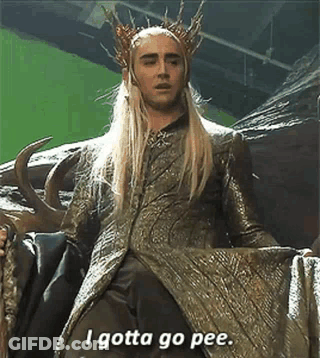 A Man In A Crown Is Sitting On A Chair And Saying `` I Gotta Go Pee '' . GIF