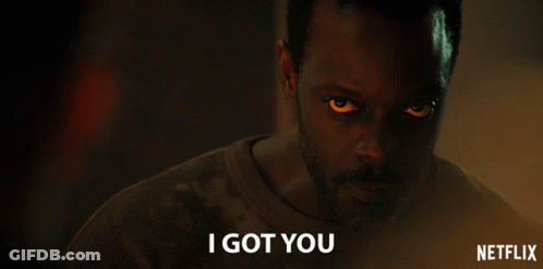 A Man In A Dark Room With A Netflix Logo In The Corner GIF
