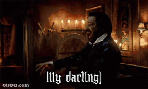 A Man In A Dark Room With Candles And The Words My Darling GIF