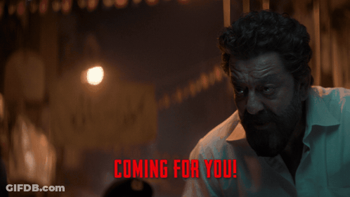 A Man In A Dark Room With The Words " Coming For You " On The Bottom GIF