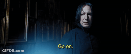A Man In A Dark Room With The Words Go On Above Him GIF