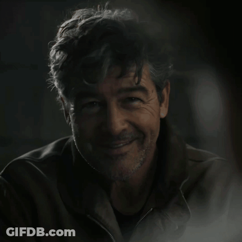 A Man In A Dark Room With The Words Green Lantern On The Bottom GIF