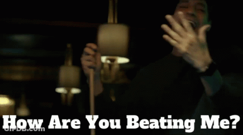 Man In Dark Room With How Are You Beating Me GIF