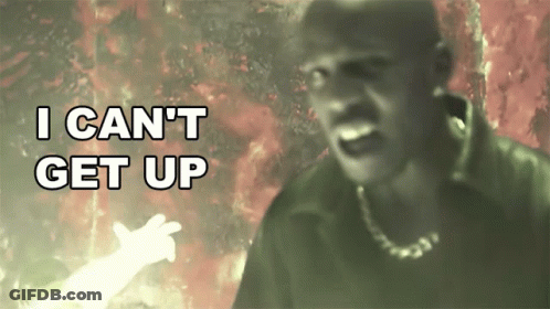 A Man In A Dark Room With The Words I Can 'T Get Up Behind Him GIF