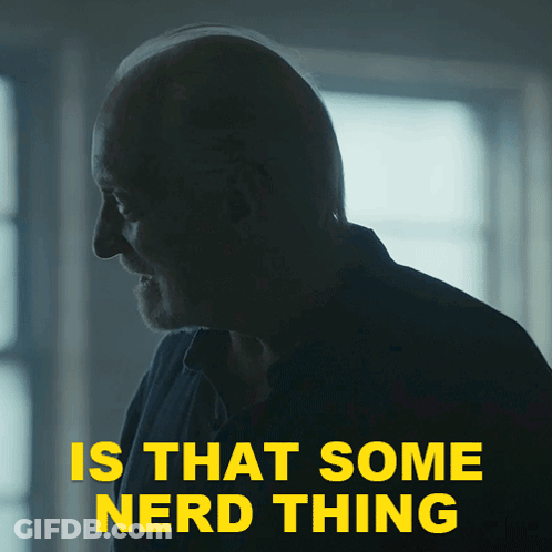 A Man In A Dark Room With The Words " Is That Some Nerd Thing " Above Him GIF