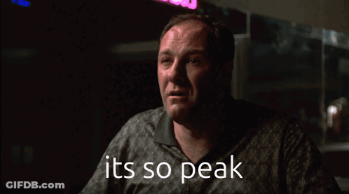 A Man In A Dark Room With The Words It 'S So Peak Below Him GIF