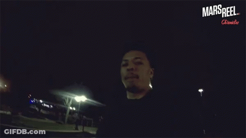 A Man In A Dark Room With The Words Mars Reel On The Bottom Right GIF