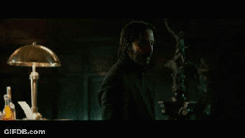 A Man In A Dark Room With The Words " Not If I See You First " On The Screen GIF