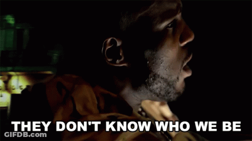 A Man In A Dark Room With The Words They Don 'T Know Who We Be Below Him GIF