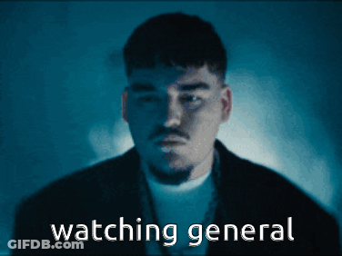 A Man In A Dark Room With The Words " Watching General " Behind Him GIF