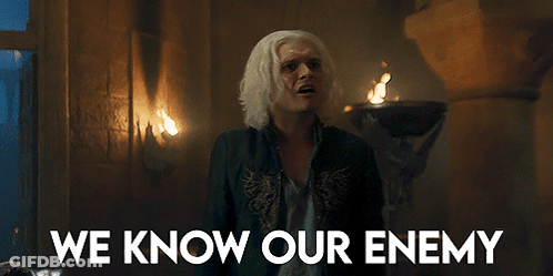 A Man In A Dark Room With The Words We Know Our Enemy Above Him GIF