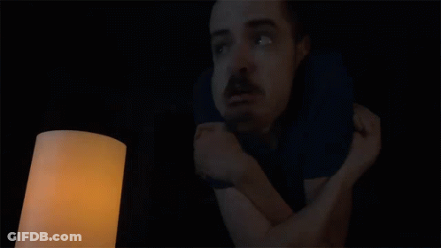 A Man In A Dark Room With The Words When Is The Power Coming Back On Above Him GIF