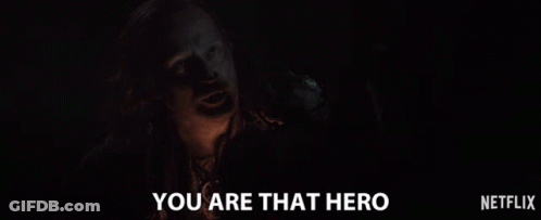 A Man In A Dark Room With The Words You Are That Hero Below Him GIF
