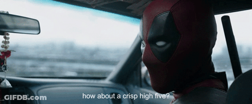 A Man In A Deadpool Costume Is Sitting In The Driver 'S Seat Of A Car GIF