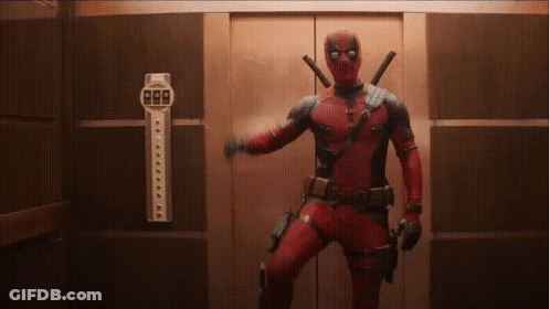 A Man In A Deadpool Costume Is Standing In An Elevator Holding A Gun . GIF
