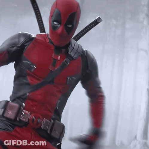 A Man In A Deadpool Costume With Two Swords On His Shoulder GIF