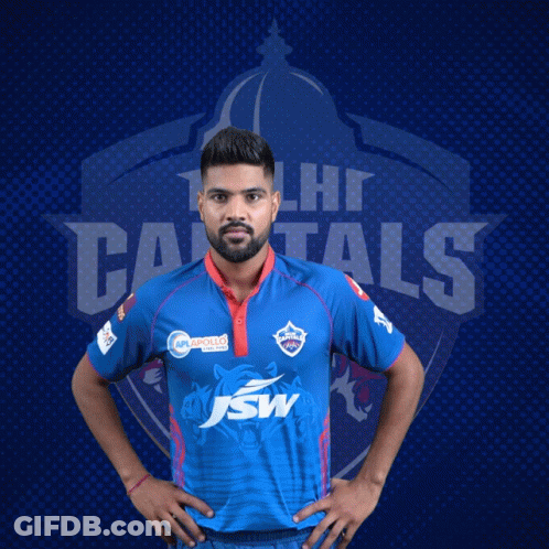 A Man In A Delhi Capitals Jersey Poses For A Photo GIF
