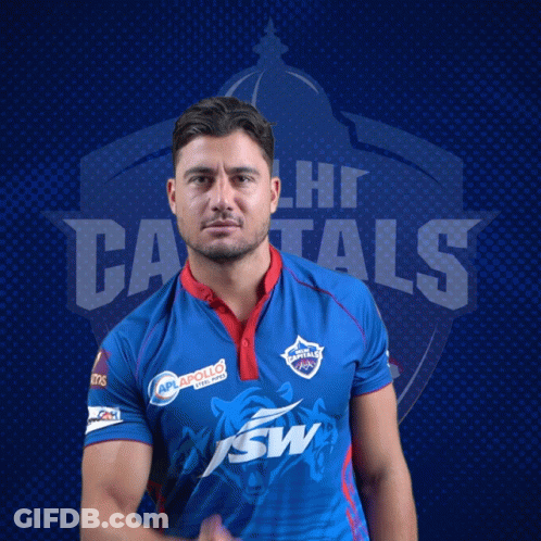A Man In A Delhi Capitals Jersey Poses For A Picture GIF