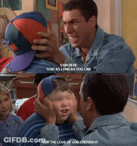 A Man In A Denim Jacket Holds A Boy 'S Hat And Says " Stay Here " GIF